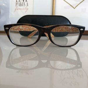 RayBan Wayfarer eyeglasses.